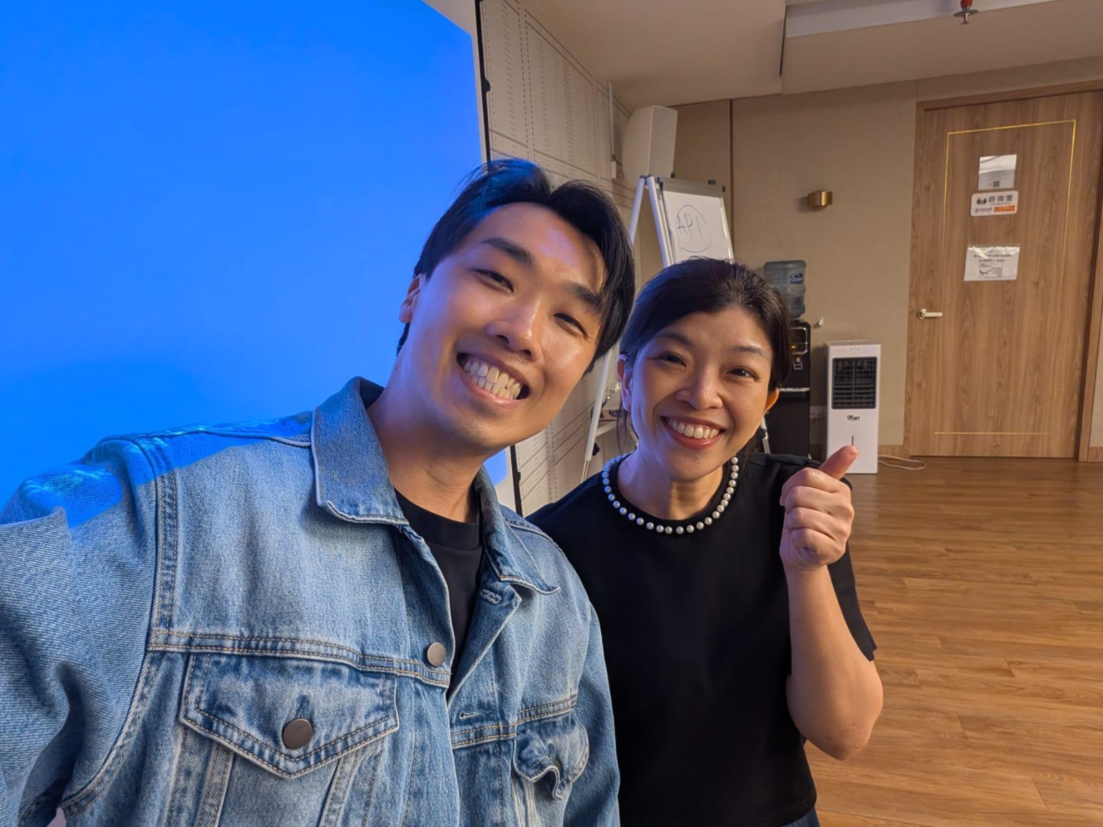 Sam Neo and a workshop attendee taking a photo in the training room.