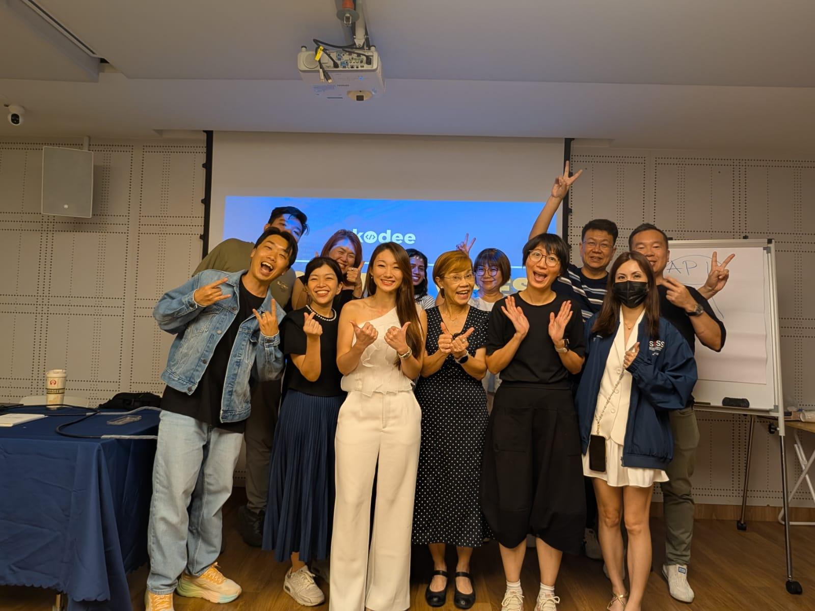 Participants and host posing together after a Kodee workshop session.